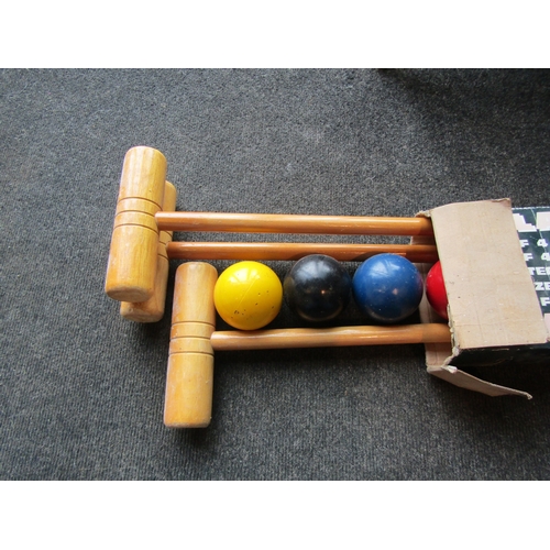 1173 - A Jaques croquet set comprising of four hardwood mallets, four balls, six hoops and winning post, bo... 