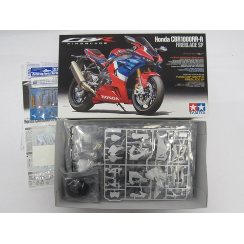 7305 - Three Tamiya Motorcycle Series 1:12 scale Honda motorcycle plastic model kits to include 14066 Honda... 