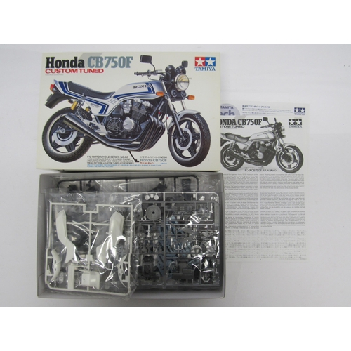 7305 - Three Tamiya Motorcycle Series 1:12 scale Honda motorcycle plastic model kits to include 14066 Honda... 