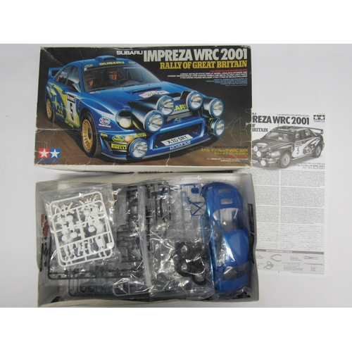 7304 - Five Tamiya 1:24 scale racing car plastic model kits to include 24093 Nissan R89C, 25210 Lancia Stra... 