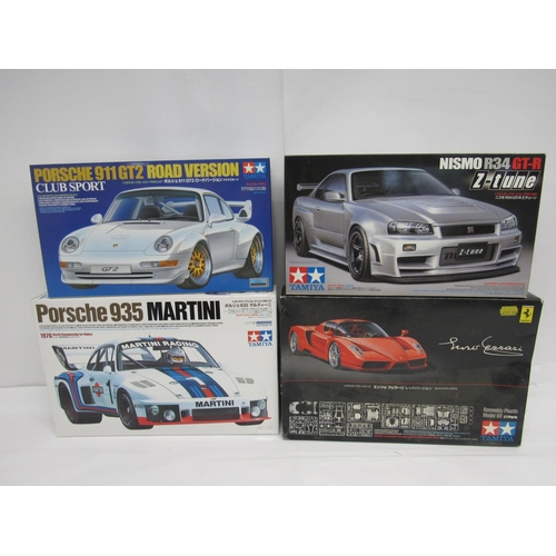 7309 - Four Tamiya racing and and road car plastic model kits to include 1:20 scale 20070 Porsche 935 Marti... 