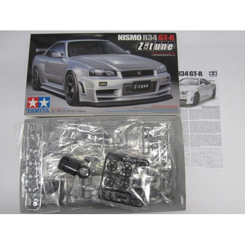 7309 - Four Tamiya racing and and road car plastic model kits to include 1:20 scale 20070 Porsche 935 Marti... 