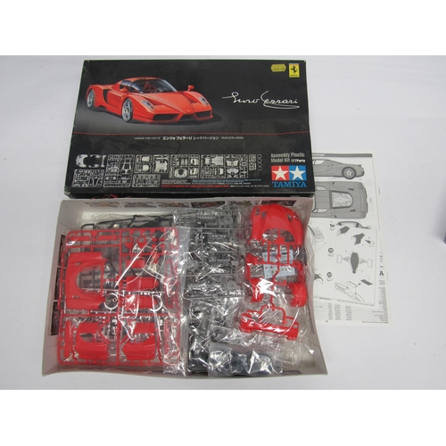 7309 - Four Tamiya racing and and road car plastic model kits to include 1:20 scale 20070 Porsche 935 Marti... 