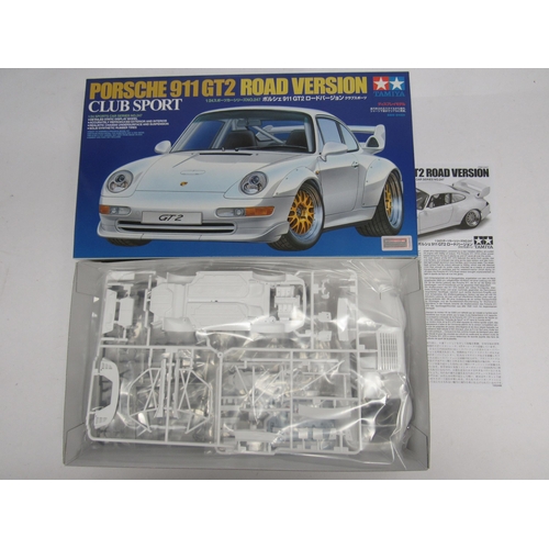 7309 - Four Tamiya racing and and road car plastic model kits to include 1:20 scale 20070 Porsche 935 Marti... 