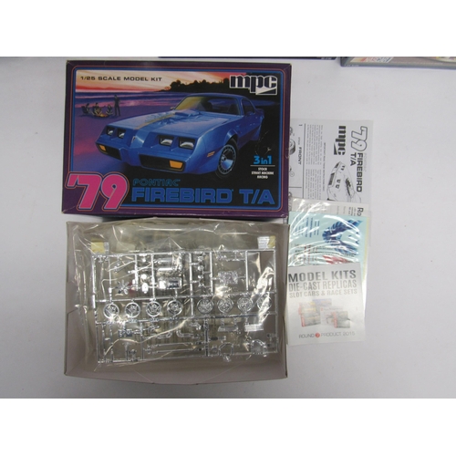 7343 - A collection of racing and road car plastic model kits to include AMT ERTL 1:25 scale 6962 Coors Bil... 