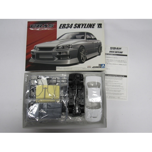 7313 - Three assorted racing and road car plastic model kits to include Fujimi 1:20 scale 091969 Ferrari 12... 