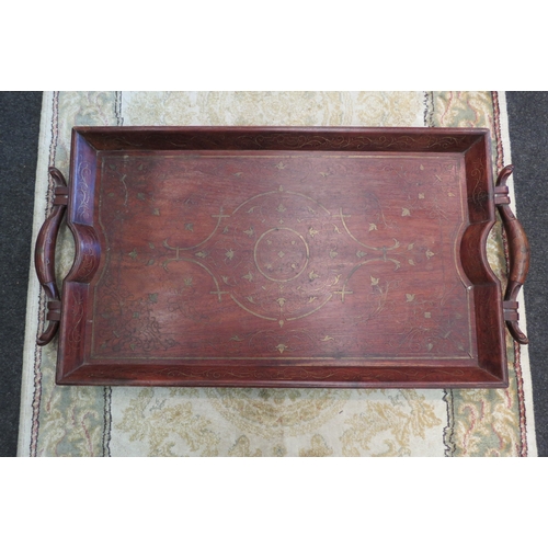 1378 - An Eastern hardwood twin handled tray with brass inlaid decoration, 73cm x 38.5cm overall