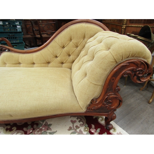 1118 - A Victorian walnut chaise longue, buttoned chenille upholstery, scrolled foliate carved frame and se... 