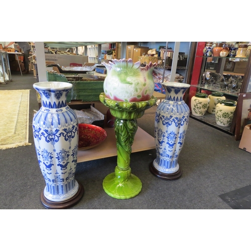 1093 - A pottery jardiniere on stand (a/f) and a pair of blue and white vases on stand, one a/f (3)