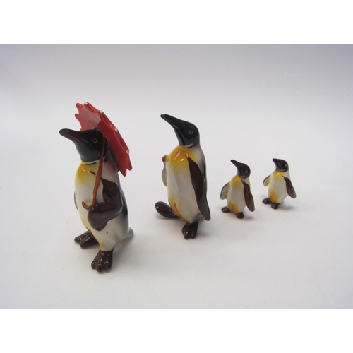 8028 - A set of four Beswick Family Penguins - Penguin with umbrella, model no. 802, Penguin with walking s... 