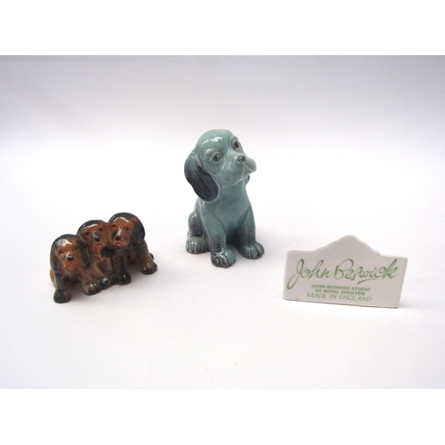 8047 - A Beswick Lollopy Dog - seated Puppy in blue gloss, model no. 454, three Puppies in gloss, model no.... 