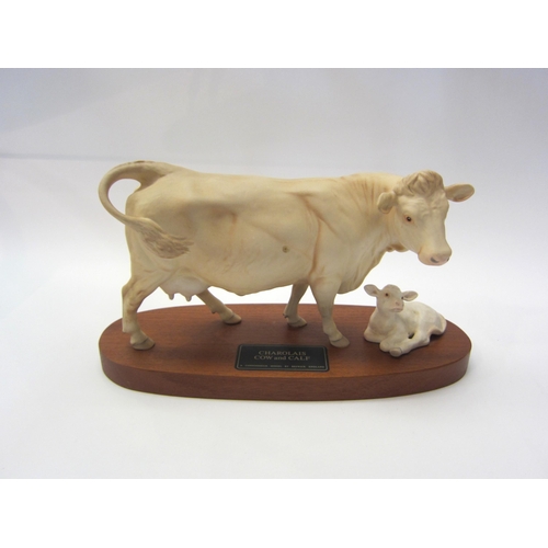 8070 - A Beswick Charolais Cow and Calf on wooden plinth, in satin matt, model no. 2648/2652