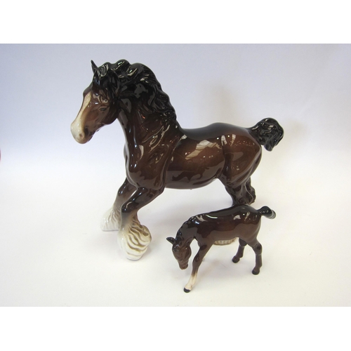 8083 - A Beswick Cantering Shire in brown gloss, model no. 975 together with a Beswick Foal grazing, model ... 