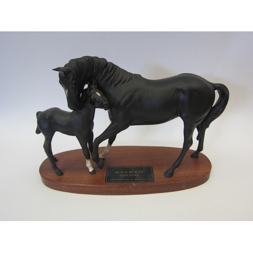 8085 - A Beswick Black Beauty and foal in matt on plinth,  model no. 2536