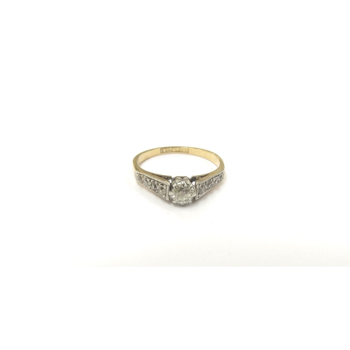 9044 - An 18ct gold platinum set diamond solitaire with diamond set shoulders. Size L, 2.3g