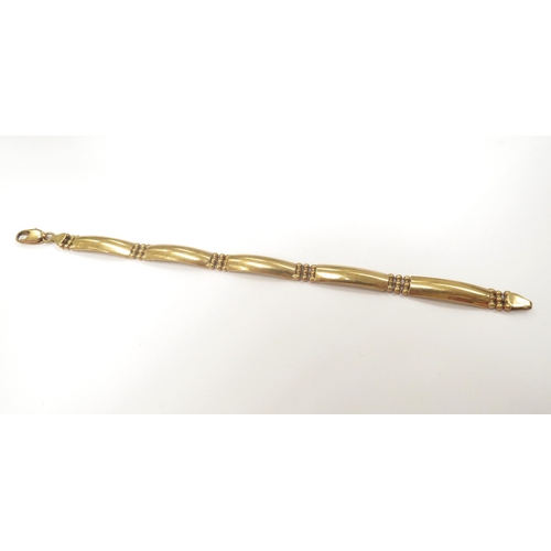 9043 - A gold bracelet with five curved panels, stamped 750, 19cm long, 12.7g