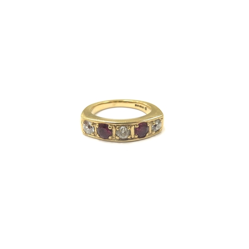 9049 - An 18ct gold five stone diamond and ruby ring. Size N, 8.4g