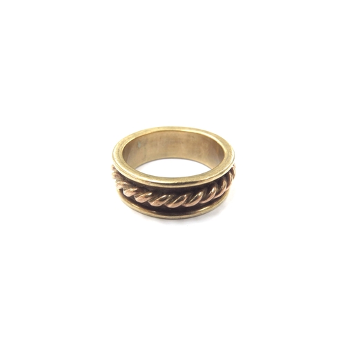 9080 - An unmarked two tone gold band with rose gold twist to centre. Size U/V, 9.6g