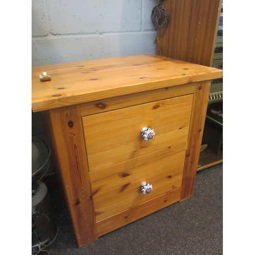 2224 - A natural pine bedside chest of two drawers, 58cm tall x 62cm wide x 45cm deep