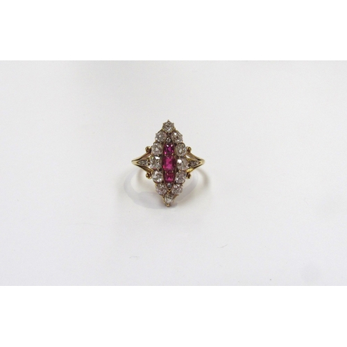 9298 - An old cut diamond and ruby navette ring the central three vertical set rubies framed by old cut dia... 