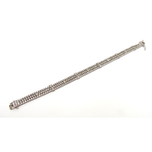 9421 - A white gold three row flexible diamond bracelet, 6ct total approx, stamped 18k, 18cm long, 18.3g