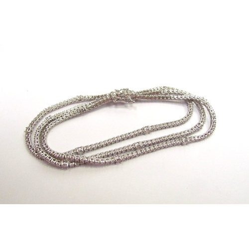 9421 - A white gold three row flexible diamond bracelet, 6ct total approx, stamped 18k, 18cm long, 18.3g