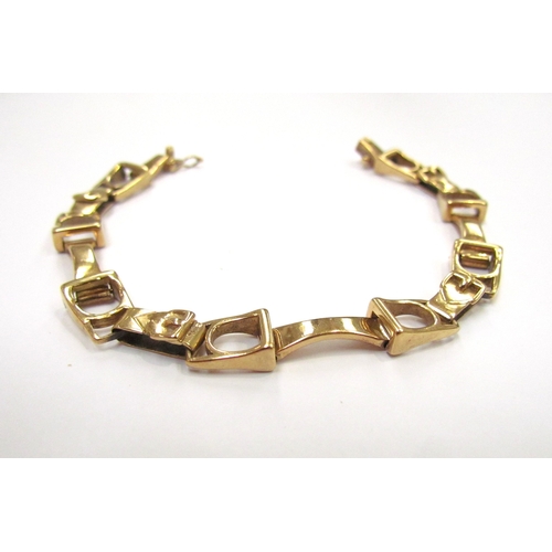 9285 - An 18ct gold bracelet with double horse bit and buckle style links, marks rubbed, 17.5cm long, 24.4g