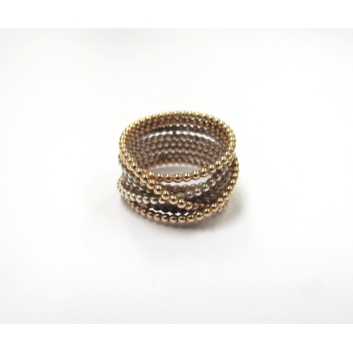 9378 - A two tone ring of coiled crossover design. Size O, 6.8g