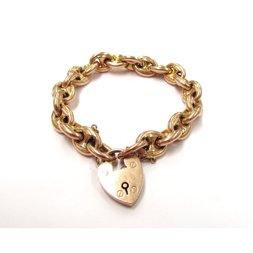 9310 - A gold hollow coffee bean link bracelet with padlock clasp, marked 9ct, 18cm long, 23.6g