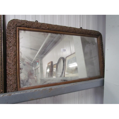 2113 - A Victorian overmantle mirror with embossed frame