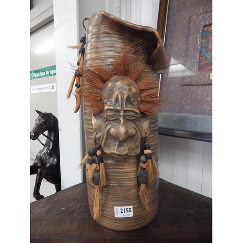 2127 - An Art Pottery jug with tribal face to side   (R) £25