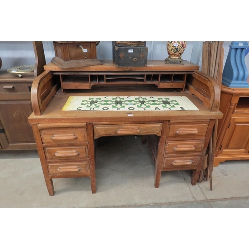 2196 - An Edwardian oak desk with tambour roll top and fitted interior, tambour for re canvasing