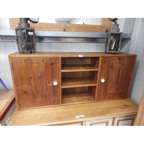 2221 - A pine wall unit with two cupboards and three shelves