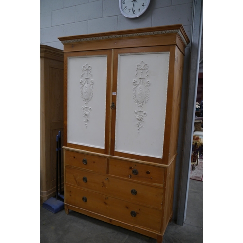 2247 - A Victorian pine cupboard on chest with linen tray top and a classical painted front