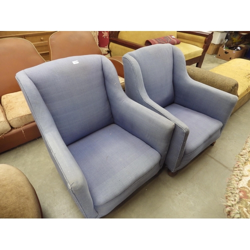 2266 - A pair of 1920's blue arm chairs on bun feet