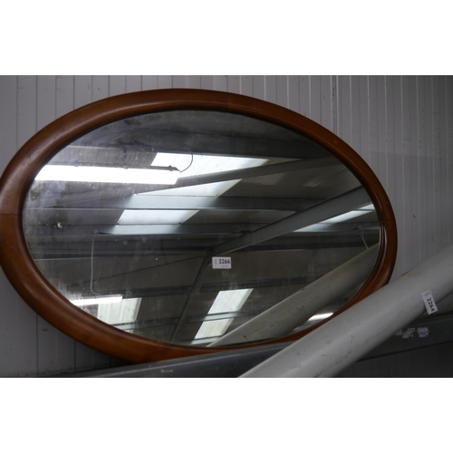 2319 - An Edwardian mahogany framed oval wall mirror