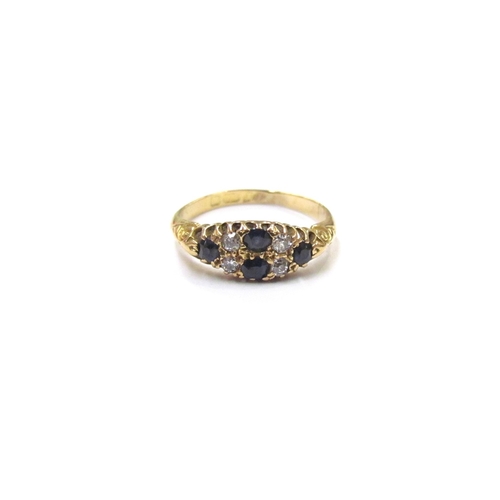 9354 - An 18ct gold old cut diamond and sapphire ring in scroll mount. Size N, 3g        (E) £100-120