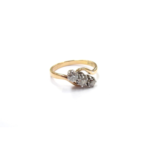 9312 - An 18ct gold three stone diamond crossover ring, 0.45ct total approx. Size N, 2.6g       (R) £200