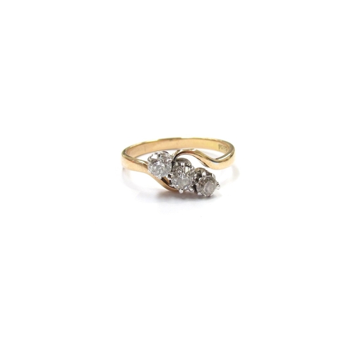 9312 - An 18ct gold three stone diamond crossover ring, 0.45ct total approx. Size N, 2.6g       (R) £200