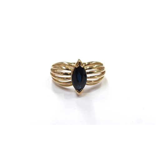 9353 - A 9ct gold ring centrally set with a marquise cut sapphire in an open shoulder. Size P/Q, 3.5g