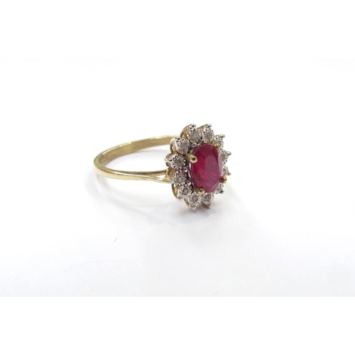 9326 - A 9ct gold ruby and illusion set diamond cluster ring. Size P, 2.3g