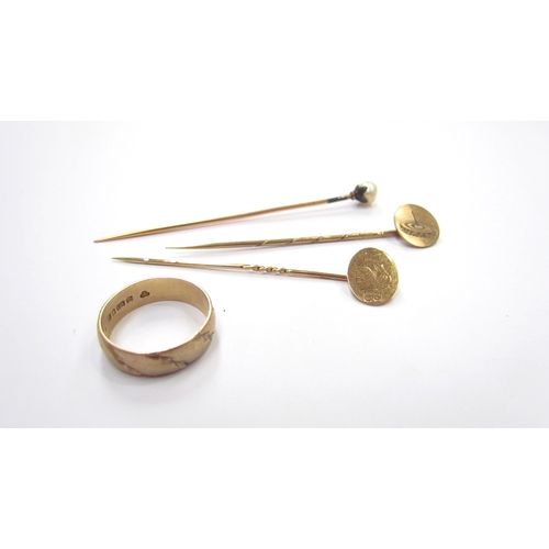 9411 - A 9ct gold band, size M/N, two 9ct gold stick pins and another, 6g marked gold