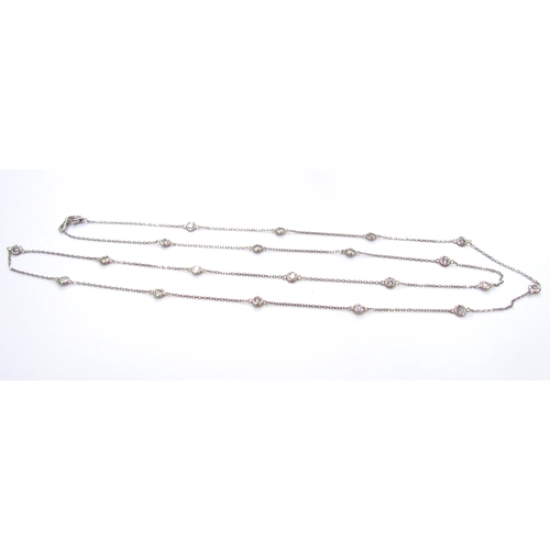 9423 - A white gold diamond set chain, 20 diamonds in rubover settings (3ct total approx) equally spaced on... 