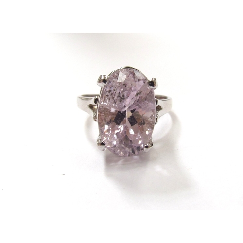 9325 - A white gold ring set with a large oval pink Kunzite 15mm x 10mm, stamped 14k. Size R, 6.6g         ... 