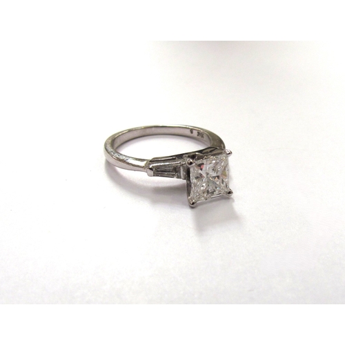 9296 - A white gold princess cut diamond solitaire ring 1ct approx, with tapering baguette diamonds to shou... 