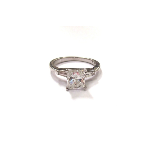 9296 - A white gold princess cut diamond solitaire ring 1ct approx, with tapering baguette diamonds to shou... 