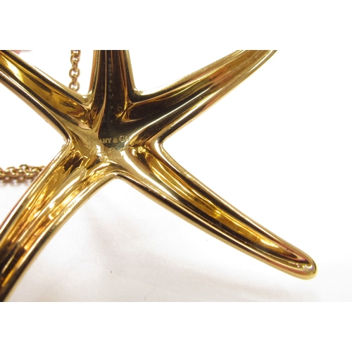 9348 - A Tiffany and Co Elsa Peretti 18ct gold pendant as a starfish 5.5cm wide hung on Tiffany and Co gold... 