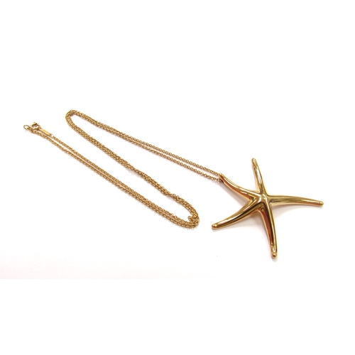 9348 - A Tiffany and Co Elsa Peretti 18ct gold pendant as a starfish 5.5cm wide hung on Tiffany and Co gold... 