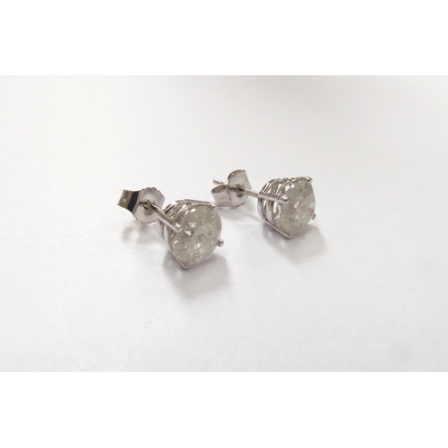 9360 - A pair of white gold diamond stud earrings 1ct each approx, stamped 14k, 1.2g