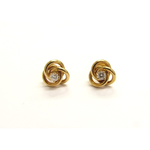 9168 - A pair of 18ct gold single diamond set knot earrings 0.30ct total, 5.4g      (R) Next Jewellery Sale